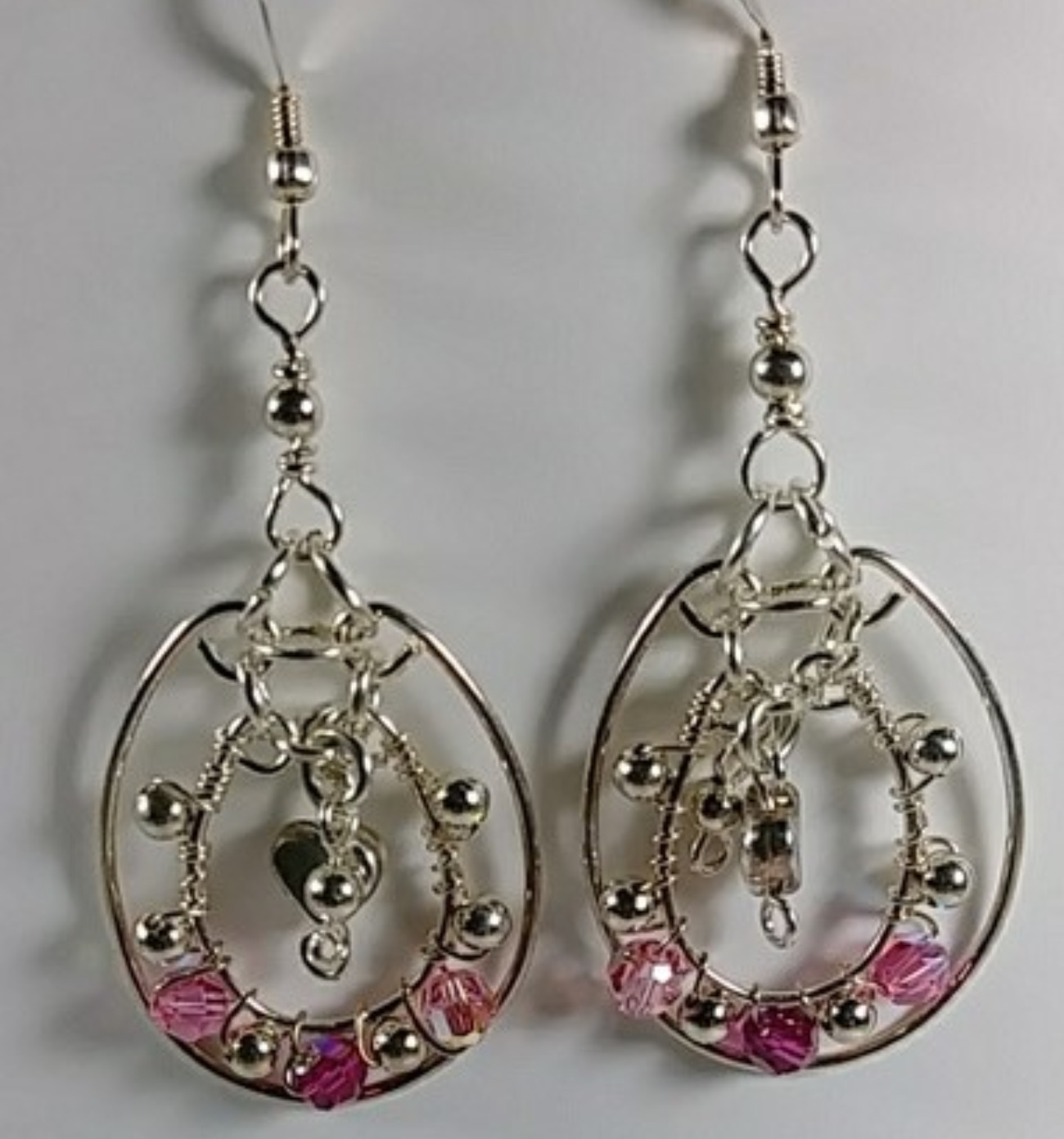 606 - EAR - Description: Earrings: Sterling Silver Earrings, Swarovski Crystal, Sterling Silver Round and Heart Beads.(Sterling Silver Earwire)  Dimension: 2 1/2 ' L (Inches)