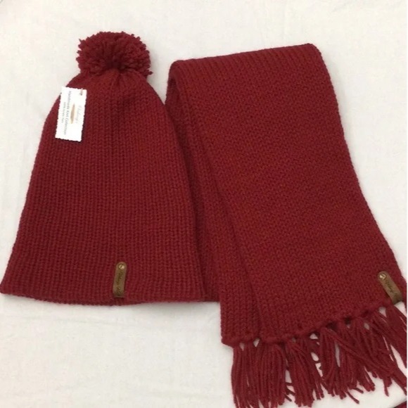 - Unisex Accessories - Material: 100% Acrylic Yarn, Custom Riveted Faux Leather Tags  Construction: Double Layered Knit Scarf and Beanie    Color(s): Claret Red  Size: OS Stretchable 
