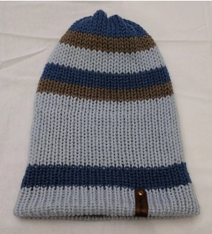 - Unisex Accessory - Material: 100% Acrylic Yarn / Custom Faux Leather Tag - Care: Hand Wash, Cold Water, Dry Flat - Construction: Reversible, Double Layered Knit Beanie (handmade) - Size: Adult (One Size) Stretchable - Color(s): Blues and Putty - Item packed in clear resealable plastic storage bag