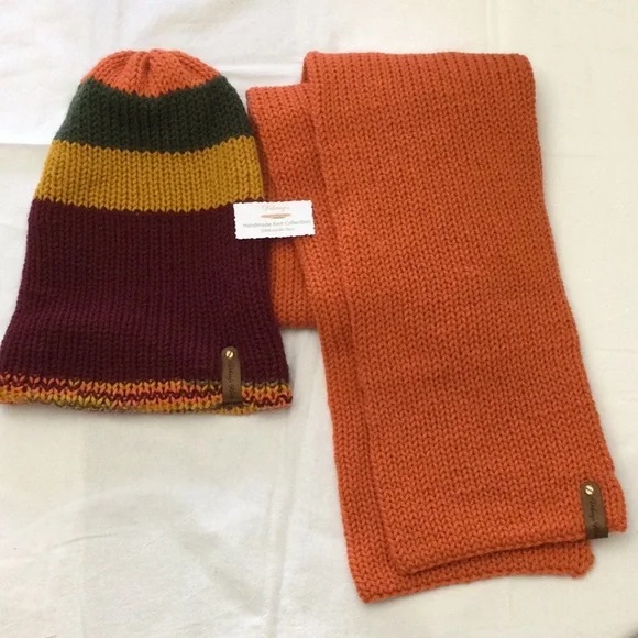 - Unisex Accessories - Material: 100% Acrylic Yarn, Custom Riveted Faux Leather Tags  Construction: Double Layered Knit Scarf and Beanie    Color(s): Pumpkin, Gold, Green and Burgundy  Size: OS Stretchable 